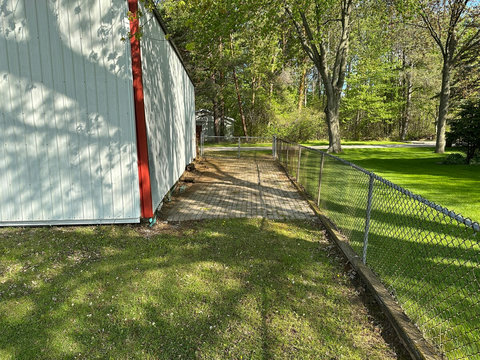 Vehicle access from the road to the boat launch alongside the pole barn.
