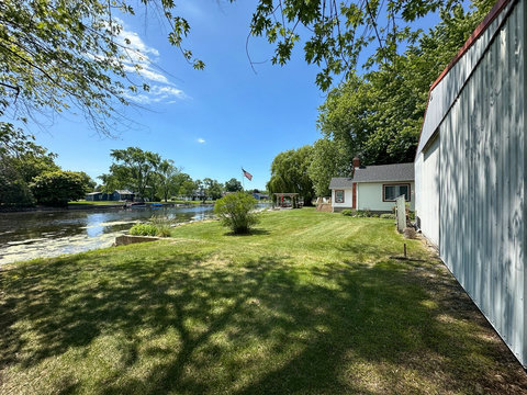 Looking West, showing the large back yard and frontage available to you during your stay.