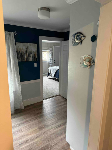 Looking from the coffee bar into the guest room and on into the master. The bathroom is accessed through the guest room.