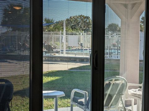 Sliding Glass Door to Covered Patio and large backyard.