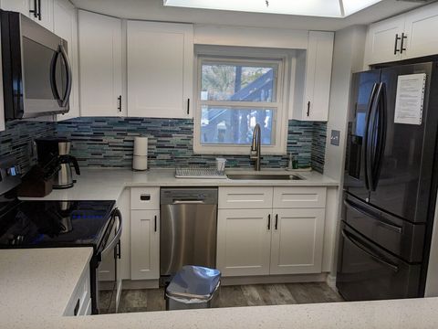 Large Sink with Pull Down Faucet. Refrigerator with Large Ice Maker