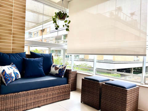 Glass window on the whole varanda (it may be totally opened or closed) and Sun Block UV Roll-on curtains for thermal comfort and privacy.