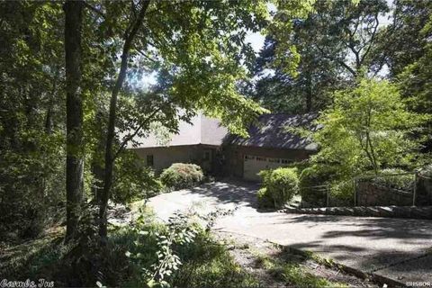 Front of home and driveway leading to home.