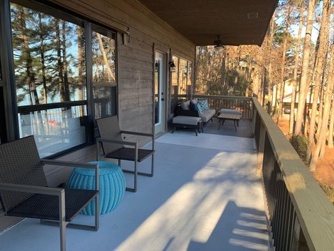 Upper balcony outdoor furniture setup. Couch with coffee table and two ottomans. Also have 2 chairs with table. These chairs can be used at outdoor dining table if needed. 