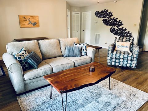 Lower living area provides sleeper sofa, chair, and TV. 