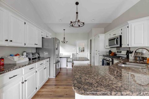 Gas stove, microwave, toaster oven & toaster, keurig with coffee pot, and small island available in kitchen 
