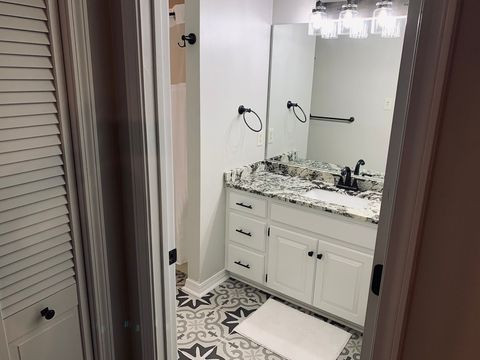 Full bath on lower level. This bathroom is situated next to bedroom #2 and has shower/tub combo