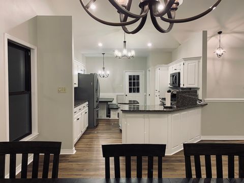 Well stocked kitchen. Kitchen, dining room, and living room in open concept. Breakfast nook in kitchen with ability to seat 6.
