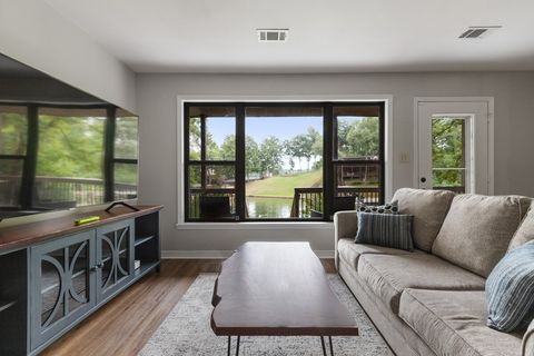 Lower level living area provides direct access to lake. Sleeper sofa, chair, and big screen TV available. The lower level provides a  living room, 2 full bathrooms, 2 bedrooms with king beds, and bedroom with bunk beds.