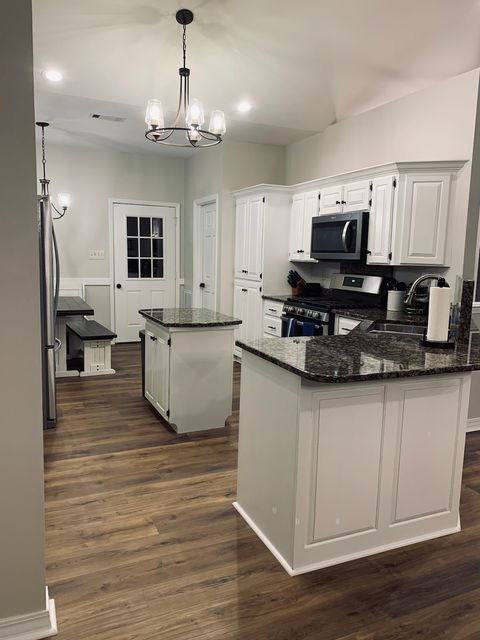 Open concept kitchen with breakfast nook that seats 6.