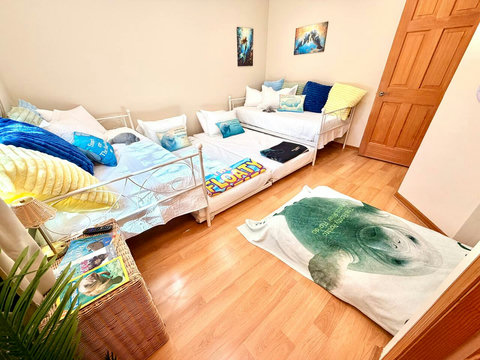 Adults will feel more comfortable on the upper twin beds.  The trundle beds are best for teens and younger.  The fold-out bed is best for a younger child.  This room can comfortably sleep 2 adults or 5 children. 