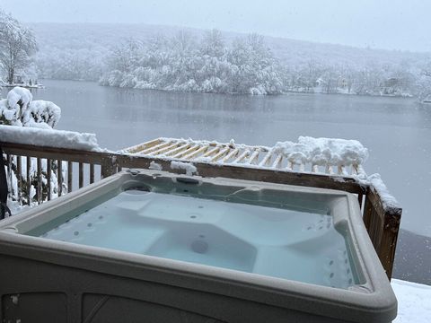 Enjoy winter in our 5-Person Hot Tub on the deck. 