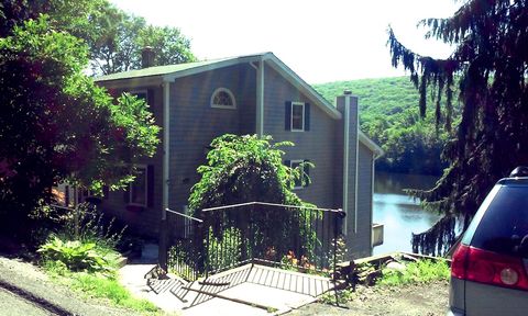 View of the house from the street and parking