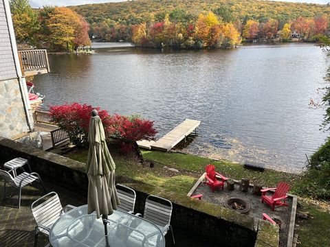 BBQ patio and Fireplace overlooking the lake in fall