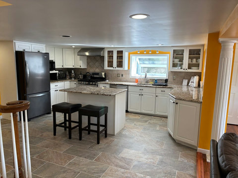 Large kitchen with beautiful granite tops and all appliances to enjoy a fabulous cooking experience