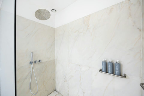 Large marble bathroom with walk-in rain shower. 24-hour high water pressure hot water. Toilet, bidet, washbasin and hair dryer.   Free toiletries : hand soap, shampoo, conditioner, and body soap and toilet paper.  Free quality towels.