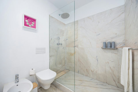 Large marble bathroom with walk-in rain shower. 24-hour high water pressure hot water. Toilet, bidet, washbasin and hair dryer.   Free toiletries : hand soap, shampoo, conditioner, and body soap and toilet paper.  Free quality towels.