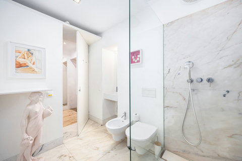 Large marble bathroom with walk-in rain shower. 24-hour high water pressure hot water. Toilet, bidet, washbasin and hair dryer. Free toiletries : hand soap, shampoo, conditioner, and body soap and toilet paper. Free quality towels.
