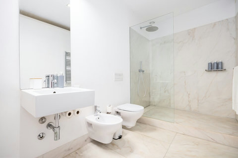 Large marble bathroom with walk-in rain shower. 24-hour high water pressure hot water. Toilet, bidet, washbasin and hair dryer.   Free toiletries : hand soap, shampoo, conditioner, and body soap and toilet paper.  Free quality towels.