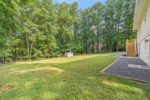 Large backyard with charcoal grill