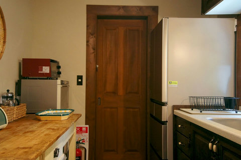 we have a full size refrigerator in the kitchen