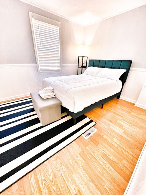 Guest Bedroom with plush brand new Queen bed and fresh white linens