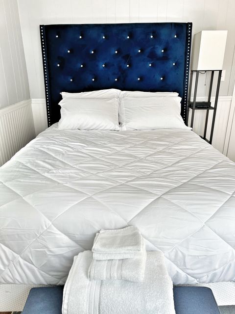 Master Bedroom with plush brand new Queen bed and fresh white linens