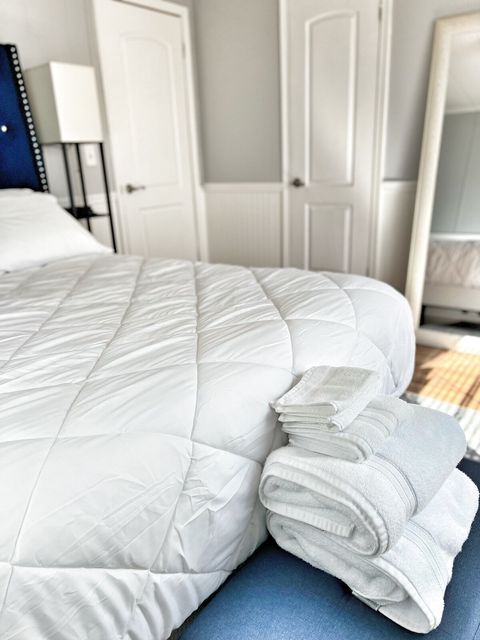 Master Bedroom with plush brand new Queen bed and fresh white linens