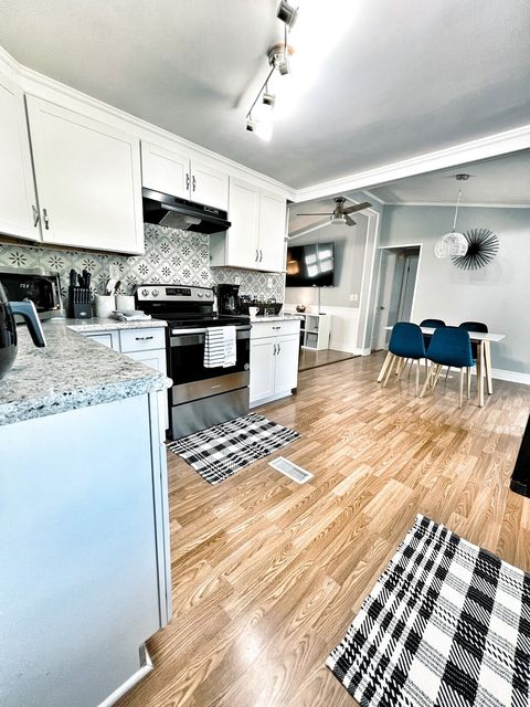 Kitchen & Dining with view of 70" TV