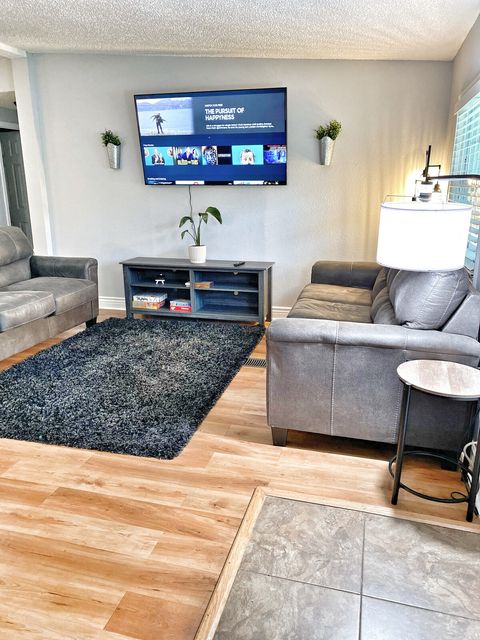 Living Room with 65 inch Samsung Smart TV, Games & Comfy new Sofas.