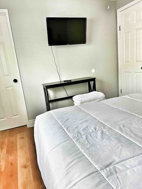 3rd Bedroom with Full Size Plush Bed, 32” Smart TV, closet with single roll away bed and full size Air bed in closet.