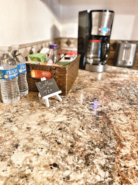Coffee & Tea station equipped with coffee, filters, sugar, half & half, tea, honey & agave.