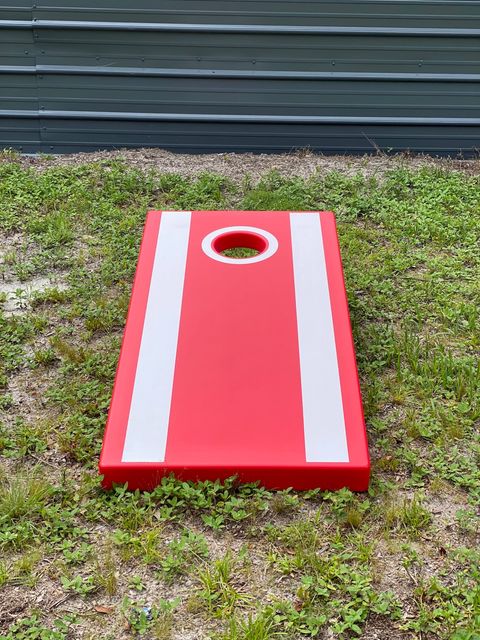 Cornhole Game in privacy fenced back yard