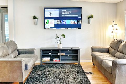 Living Room with 65" Samsung Smart TV and games.