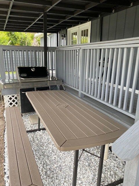 Outdoor dining area with top of the line Weber Gas Grill.