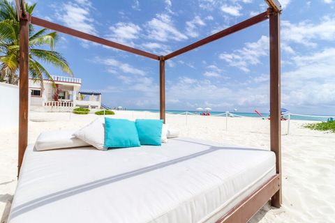 Lounge on the private day bed on the beach