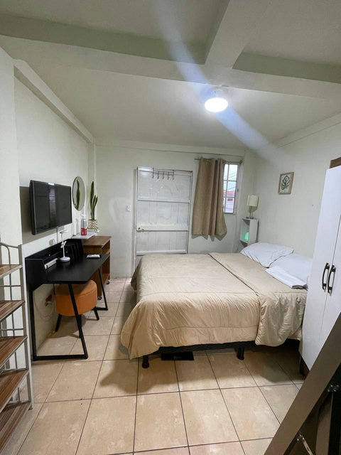 Bedroom 3 is fully furnished with a desk, wardrobe, desk, shelves, Smart TV, air conditioner and a complete bathroom. This room can sleep up to 2 people.