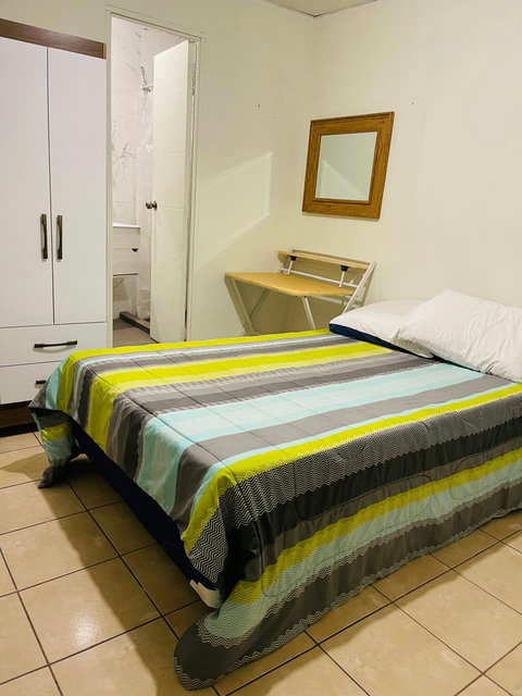 Bedroom 3 is furnished completely with a Smart TV, Wardrobe, Desk and a full private bathroom. This room can sleep up to 2 people.