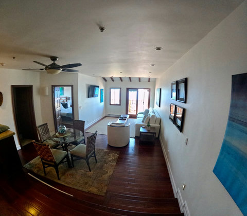 - Slide open those balcony doors & let the sea breeze fill a space designed for comfort
- Savor local flavors at the glass top table, just steps from the cozy living room TV nook
- Plush bedroom and feel the laid back coastal rhythm throughout
