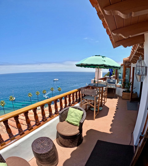 - Coastal views from this spacious balcony with shaded seating & a BBQ grill
- Wicker lounge chairs & a high top dining set offer perfect spots for every hour of the day
- Soak up the sun, watch passing boats, & toast to golden sunsets over the Pacif