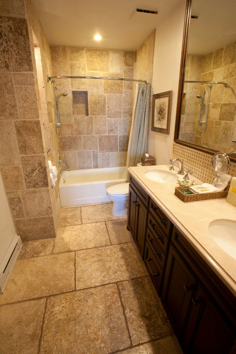 - Refresh in a spa inspired bathroom with natural stone tile and a full size soaking tub
- Double vanity setup makes mornings smoother for couples and families alike
- Equipped with fresh towels, toiletries, and thoughtful touches for a comfy stay