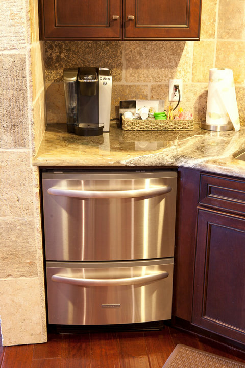 - Wake up to your favorite brew with the Keurig coffee station, complete with a selection of pods
- Handy beverage accessories and paper towels make mornings seamless
- Located right next to sleek double drawer refrigerators for added convenience