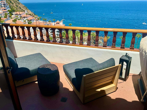 - Two cozy loungers and a side table set the vibe for epic sea gazing and breezy naps
- Watch sailboats glide by or toast the sunset in your private coastal nook
- This is your VIP ticket to blue horizons and pure island calm