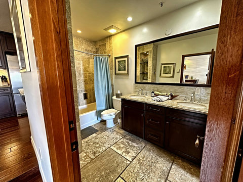 - Pamper yourself in a spa like retreat with luxe stonework and warm designer touches
- Double sinks, plush towels, and thoughtful lighting make every moment feel indulgent
- Perfect space to refresh, unwind, and feel truly at home