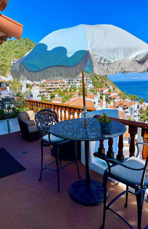 - Sip wine or morning espresso beneath a fringed umbrella with views that stretch to forever
- Perched above red tiled rooftops with hills & waters in every direction
- Elegant seating invites you to linger, relax, & soak in the Mediterranean style m