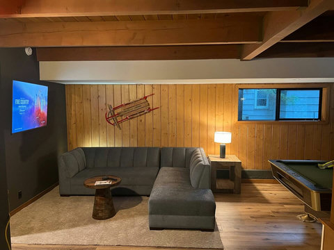 - Chill in style with a plush L shaped sofa, ideal for group hangouts or solo downtime
- Enjoy casual fun with a pool table & streaming ready smart TV in the same space
- Warm wood tones, soft lighting, & thoughtful layout offer both comfort & charm