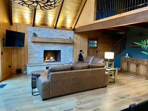 - Kick back by the fire in this dramatic great room, where cathedral ceilings meet rustic charm
- Curl up on leather seating, sip something warm, & let the glow set the mood
- Perfect blend of lodge comfort & elevated design welcomes you in to unwind