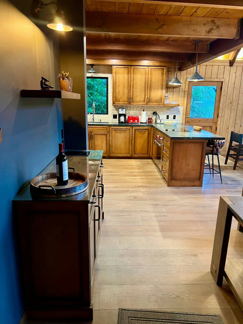 - Start your morning with ease at the sleek coffee station framed by window views
- Effortless hosting with spacious countertops, extra cabinetry, & ambient lighting
- Sip & savor in style at the wine nook, perfect for evening relaxation