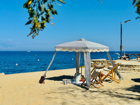 Unwind in a cozy, shaded cabana with a front row seat to the sparkling sea and golden sands.