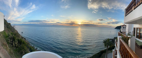 - Wake up or wind down with sweeping views of the Pacific from your balcony
- Watch the golden sun dip below the horizon with nothing but water in sight
- Peaceful cliffs, palm trees, and gentle waves complete this postcard perfect escape

